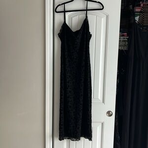 Black adjustable strap tank dress with floral pattern